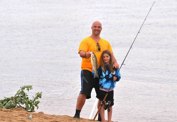 michael tininess with daughter striped bass