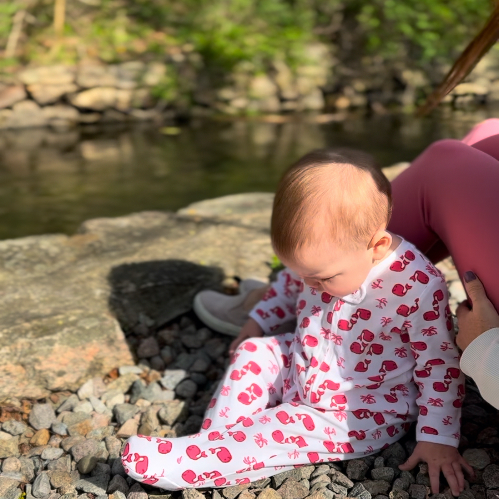 Hallie picking up rocks at Herring Run